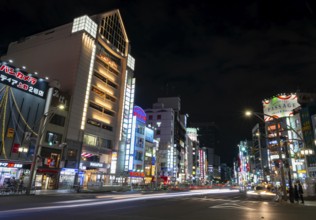 Street and neon sign, long exposure street scene at night, Tokyo, Japan