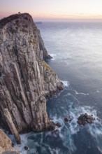 The Lanterns and Totem Pole Long exposure at sunrise shows glowing dawn over the dramatic cliffs of