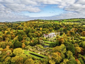 Autumn colours over Bodnant House and Garden from a drone, Conwy River, Colwyn Bay, Conwy, Wales,