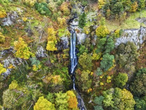 Autumn colours over Pistyll Rhaeadr Waterfall and Berwyn Mountains from a drone, Oswestry,