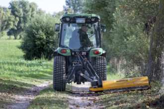 Landscape maintenance with tractor and mower, Darß, Mecklenburg-Vorpommern, Germany