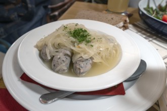 Sour tips consist of vinegar broth and cooked bratwurst, served in a Franconian inn, Bavaria,