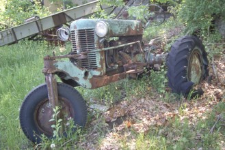 Rusted American Silver King tractor around 1930, dumped in a wooded area, Marksboro, New Jersey,