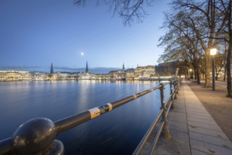 Inner Alster with footpath along Neuer Jungfernstieg at Blaue Stunde, Hamburg, Germany