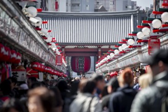 View of numerous visitors on Nakamise-dori shopping street at the Thunder Gate Kaminarimon of