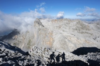 Shade of 3 mountaineers and view over the Steinerne Meer with Wildalmkirchl and Selbhorn,