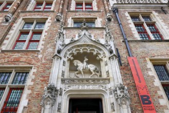 Gruuthusemuseum with equestrian statue of Lodewijk van Gruuthuse above the entrance portal in the