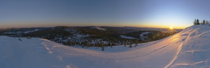View from Mount Lusen over the hills of the bavarian forest at sunrise in winter, Bavaria, Germany