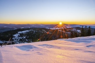 Sunrise over the hills of czech republic from Mount Lusen wth the view over the hills of the