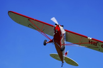 A Piper J-3C/L4 Cub light aircraft, HB-OBF registration, during a flight demonstration as part of