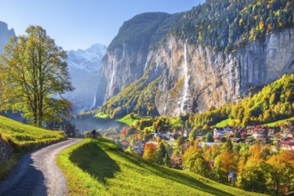 View of town and valley with Staubbach waterfall in autumn, Lauterbrunnen, Bernese Oberland, Canton