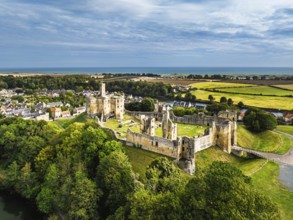 Warkworth Castle over River Coquet from a drone, Warkworth, Northumberland, England, United Kingdom