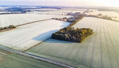 Bird Eye Perspective of Frost Covered Farmland. Seasonal Agricultural Scenery, winter and autumn
