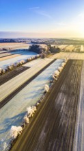 Bird Eye Perspective of Frost Covered Farmland. Seasonal Agricultural Scenery, winter and autumn