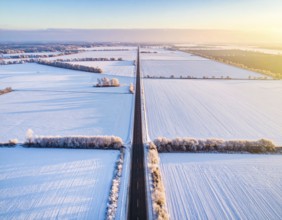 Bird Eye Perspective of Frost Covered Farmland. Seasonal Agricultural Scenery, winter and autumn