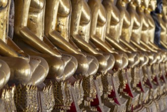 Gilded Buddha statues (Bhumispara mudra: Buddha Gautama at the moment of enlightenment), Wat Suthat