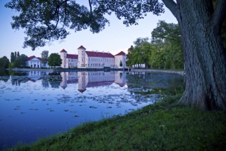 Rheinsberg Castle, lakeside with Lake Grienerick at night, prime example of Friederician Rococo,