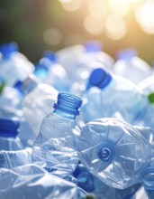 Crushed plastic water bottle waste in a wild landscape, symbol for nature protection, waste