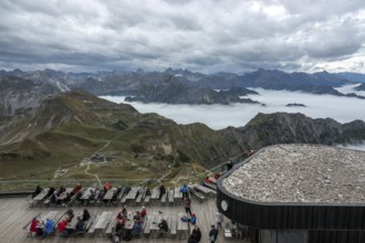 Restaurant at the Nebelhorn summit with views of the Allgäu Alps, mountains rising from fog in the