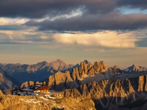 Alpenglühen, Rifugio Lagazuoi and rugged Dolomite peaks in the evening light, Dolomites, Alps,