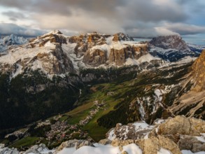 Sella group with fresh snow above the green Val Badia valley, Langkofel on the right, Dolomites,