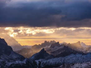 Morning light through dark clouds over the Dolomites, Alps, Belluno province, Veneto region,