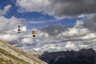 Cabins of the gondola lift to the Sassolungo Valley, Dolomites, Trentino, South Tyrol, Italy