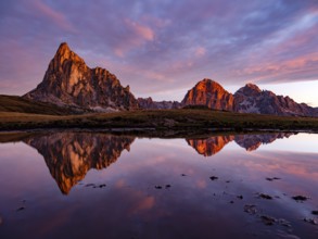 Alpine glow, reflection of the Ra Gusela and Tofane mountains at dawn, Passo di Giau, Giau Pass,