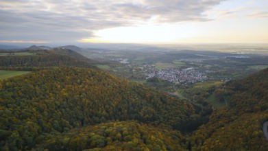 Indian summer at sunset on Albtrauf with a view of the Hohenneuffen castle ruins