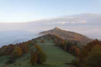 Hohenzollern Castle in a sea of fog at sunrise, autumn in the Swabian Jura
