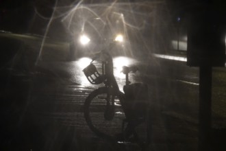 Road traffic at night and poor visibility in a city, autumn, Germany