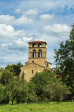 Mailhat village. Romanesque church with its square bell tower, Puy de Dome department,