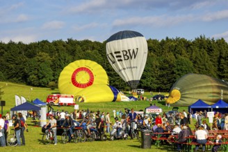 Hot air balloons being prepared for take-off as part of an air show at the Rossfeld in