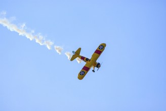 A Boeing-Stearman biplane during a flight demonstration as part of an air show at the Rossfeld in