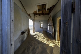 Sand mountains in a former dwelling house, interior photograph, Kolmanskop, restricted diamond