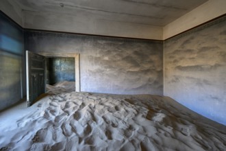 Sand mountains in a former dwelling house, interior photograph, Kolmanskop, restricted diamond