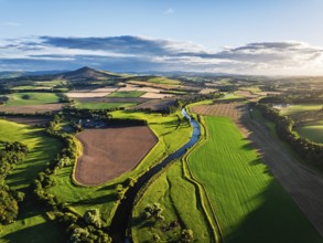 Fields and Farms over River Teviot and Minto Crags from a drone, Roxburghshire, Scottish Borders,