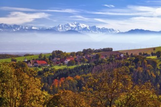 Village of Juriens in the Vaud Jura with view of Mont Blanc, haze over Lake Geneva, autumn-coloured