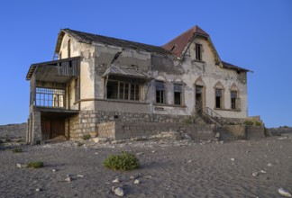 Dilapidated accountant's house in the desert sand, blue hour, Kolmanskop, near Lüderitz, Karas