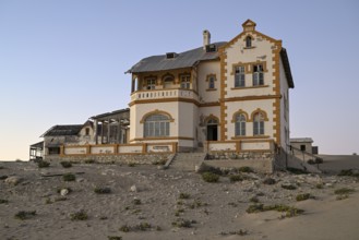 Mine manager's house in the desert sand, Kolmanskop, near Lüderitz, Karas Region, Namibia