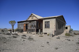 Dilapidated building in the desert sand, Pomona, restricted diamond area, near Lüderitz, Karas