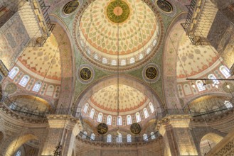 Interior and domes of the New Mosque Yeni Camii in Istanbul, Turkey
