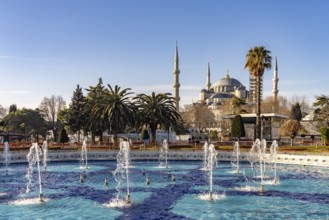 Fountain in Sultan Ahmet Park and the Blue Mosque or Sultan Ahmed Mosque in Istanbul, Turkey