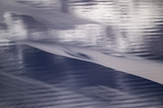 Light and shadow on gentle waves form structures on the sea surface in a bay, Otroya or Otrøya