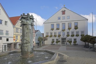 Town hall built in 1958 and town hall fountain with reliefs and figures by Klaus Ringwald 1998,