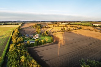 Sunset of Farms and Fields over Norham Castle from a drone, Norham, River Tweed, Northumberland,