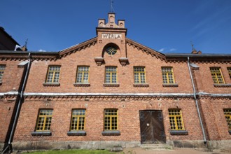 Brick façade with inscription Werla, former paper factory and mill for the production of groundwood