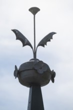 Ornamental iron element on roof peak, former paper mill for the production of groundwood pulp