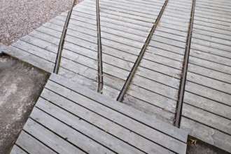 Rails for timber transport, former paper mill and mill for the production of groundwood pulp board,