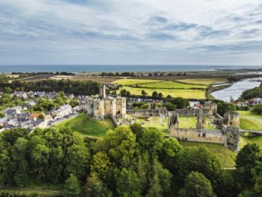 Warkworth Castle over River Coquet from a drone, Warkworth, Northumberland, England, United Kingdom